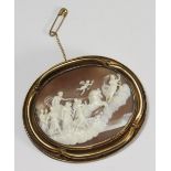 A finely worked shell cameo brooch of oval form, decorated with a scene depicting classical