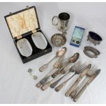 A quantity of silver-plated items including a tankard, brush set, flatware, tastevin and some shot