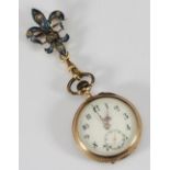 An Art Nouveau ladies 14k '585' fob watch with diamante-set blue enamelled fleur di lis clasp, white