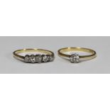 Two assorted 18ct gold and diamond rings, one a five stone example, total diamond weight