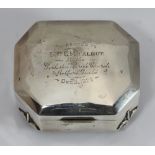 A silver jewellery box with hinged cover, raised on four fleur de lys feet, Birmingham, 1918,