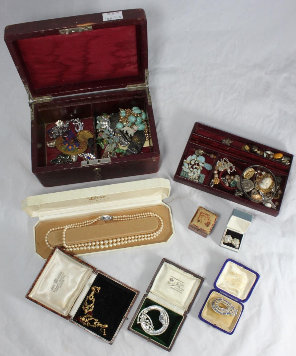 A quantity of costume jewellery including a gold heart-shaped locket, an oval silver locket with