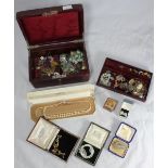 A quantity of costume jewellery including a gold heart-shaped locket, an oval silver locket with