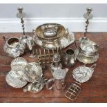 A quantity of silver-plate including toast racks, oval dishes, shell-shaped dishes and pair of
