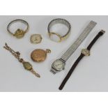 A 9ct gold Cyma 'bubble case' watch together with two various 9ct gold cocktail watches, a