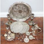 A quantity of silver plate including a circular salver, pair of candlesticks, four-piece egg