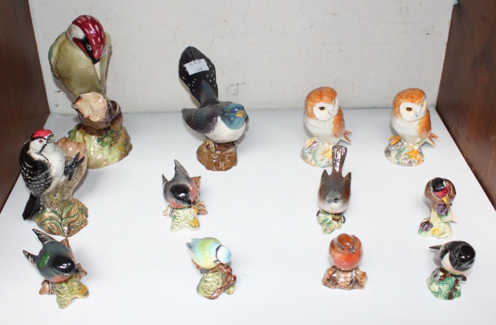 SECTION 14. A collection of twelve assorted Beswick pottery birds, including a pair of owls, a large