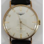 A gents Longines wristwatch c.1959-60, the silvered dial with applied gold batons denoting hours and