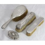 Three various silver-backed brushes and a silver trinket box, Birmingham, 1900, maker's mark of