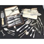 A quantity of silver-plated flatware including fish servers, knife rests, asparagus servers,