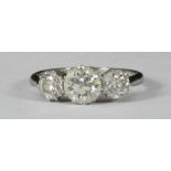 An 18ct white gold and platinum three-stone diamond ring, claw-set with three Victorian-cut