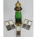 A novelty brass and glass musical decanter modelled as a lighthouse, 33cm tall, together with four