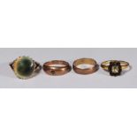 Four various 9ct gold rings, one set with an unusual cabochon stone, gross weight approximately 11.