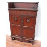 A stained oak two-door cupboard with three-quarter raised gallery top, 80cm wide