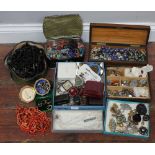 A good quantity of assorted costume jewellery comprising beads, micro-mosaic brooches, bangles,