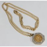 A George V 1911 full sovereign loose-set in octagonal 9ct gold pendant set with twenty-four round