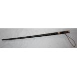 A sword stick with white metal collar and handle, black painted bamboo grip and triform blade, in
