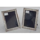 A pair of rectangular silver easel photograph frames, by E. Mander & sons