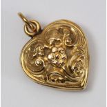 A 18ct heart pendant, with cast scrollwork decoration, weighing 4.5 grams.