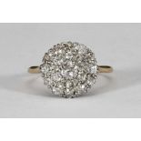 An 18ct gold diamond cluster ring, miligrain set to the top with nineteen mixed old Victorian cut