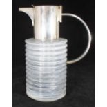 A large mould-blown glass water jug with silver-plated mount and horizontal ribbed cylindrical body,