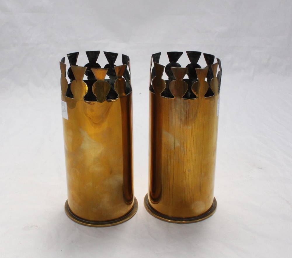 A pair of brass WWI trench art artillery shells, modelled as vases, with decorative, pierced rims,