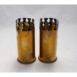 A pair of brass WWI trench art artillery shells, modelled as vases, with decorative, pierced rims,