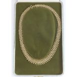 A 1960s 9ct gold necklace of flat interwoven tapering design, in fitted box, 30.0g