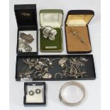 A quantity of silver and marcasite jewellery including brooches, pairs of earrings necklaces etc