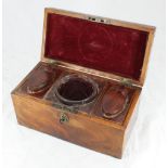 A late 18th century mahogany tea caddy of rectangular form, the hinged cover enclosing a cut glass