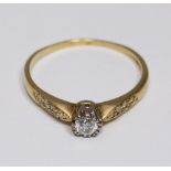 An 18ct carat yellow-gold diamond ring, centrally claw-set with a RBC diamond estimated at 0.20