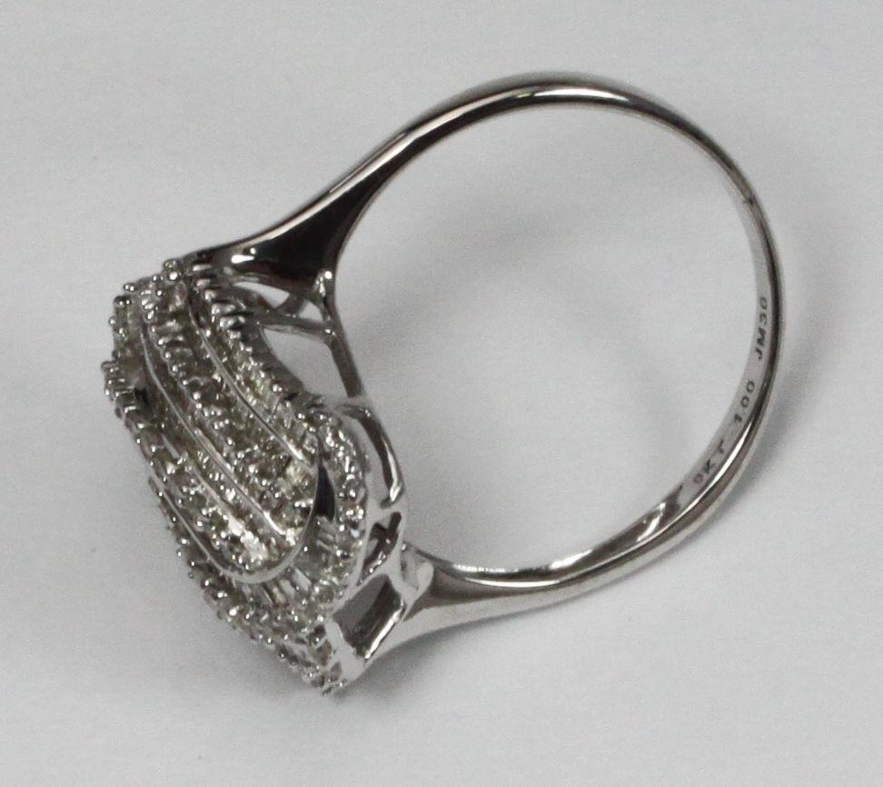 A 9ct white gold multi-row swirl design ring set with baguette and round brilliant cut diamonds. The - Bild 3 aus 3