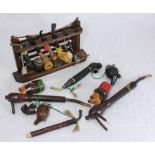 Ten various pipes including meerschaum, corn cob, two table standing pipes and a six-space wooden