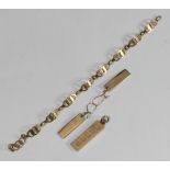 A pair of 9ct gold ingot pendant earrings and ingot necklace pendant, together with a 9ct gold