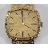 A 9ct gold Longines gents wristwatch with gold face and integral bracelet, gross weight approx. 61.