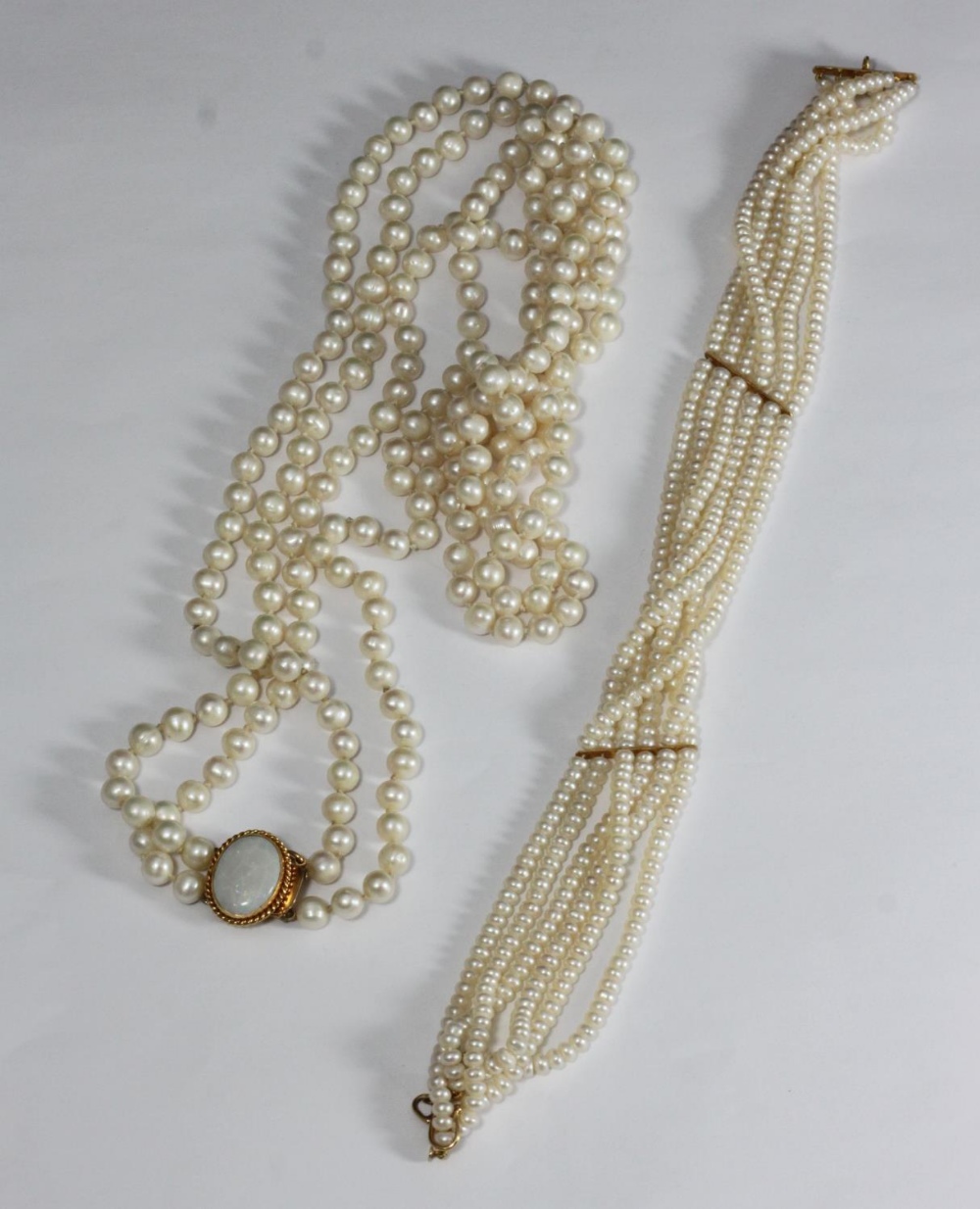 A double stringed necklace of cultured pearls, individually knotted, pearl diameter 7mm, necklace