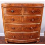 A Victorian mahogany bow-fronted chest of two short over three long, graduated drawers with turned