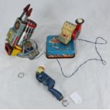 A LineMar tinplate 'George the climbing sailor,' together with a LineMar battery-operated rocket