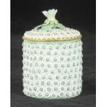 A Derby porcelain flower-encrusted Pomade pot and cover with flower finial, unmarked, 7cm high