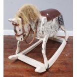 A white painted, wooden rocking horse with grey speckled detail, blonde mane and tail, 120cm long