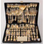 A canteen of gold-plated cutlery by W. M. Rogers & Son, in unused condition, with original plastic