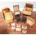 An oak and leather doll's chair with fold-down tray table, together with a doll's rocking chair with