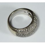 An 18ct white gold wide band pave-set with 1.00 carat of RBC diamonds. Total weight of ring 11.
