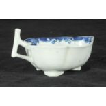 A Worcester Mansfield pattern leaf shaped butter boat, painted in underglaze blue, with pierced