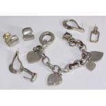 A quantity of silver and white metal jewellery including a charm bracelet with graduated heart