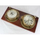 A 20th century Plastimo brass clock and barometer modelled as ship's portholes and mounted on a