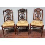 A set of six Edwardian stained beech parlour chairs with lyre backs and gold stuff-over seats (af)