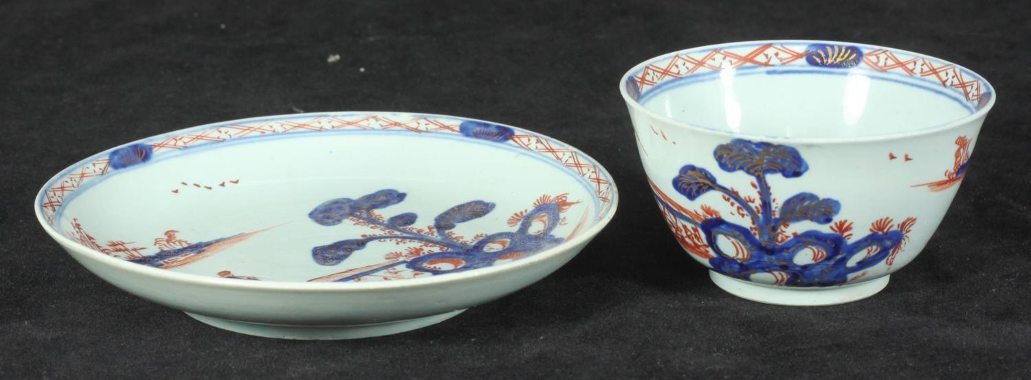 A William Ball Liverpool Porcelain tea bowl and saucer decorated with a 'man on a bridge' in