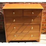 An Edwardian walnut chest of two short and three long graduated drawers, with brass pulls, 100cm