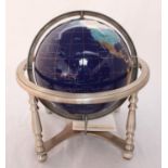 ADDENDUM DOES NOT STAY UPRIGHT. A large table-top hardstone terrestrial globe suspended in chrome